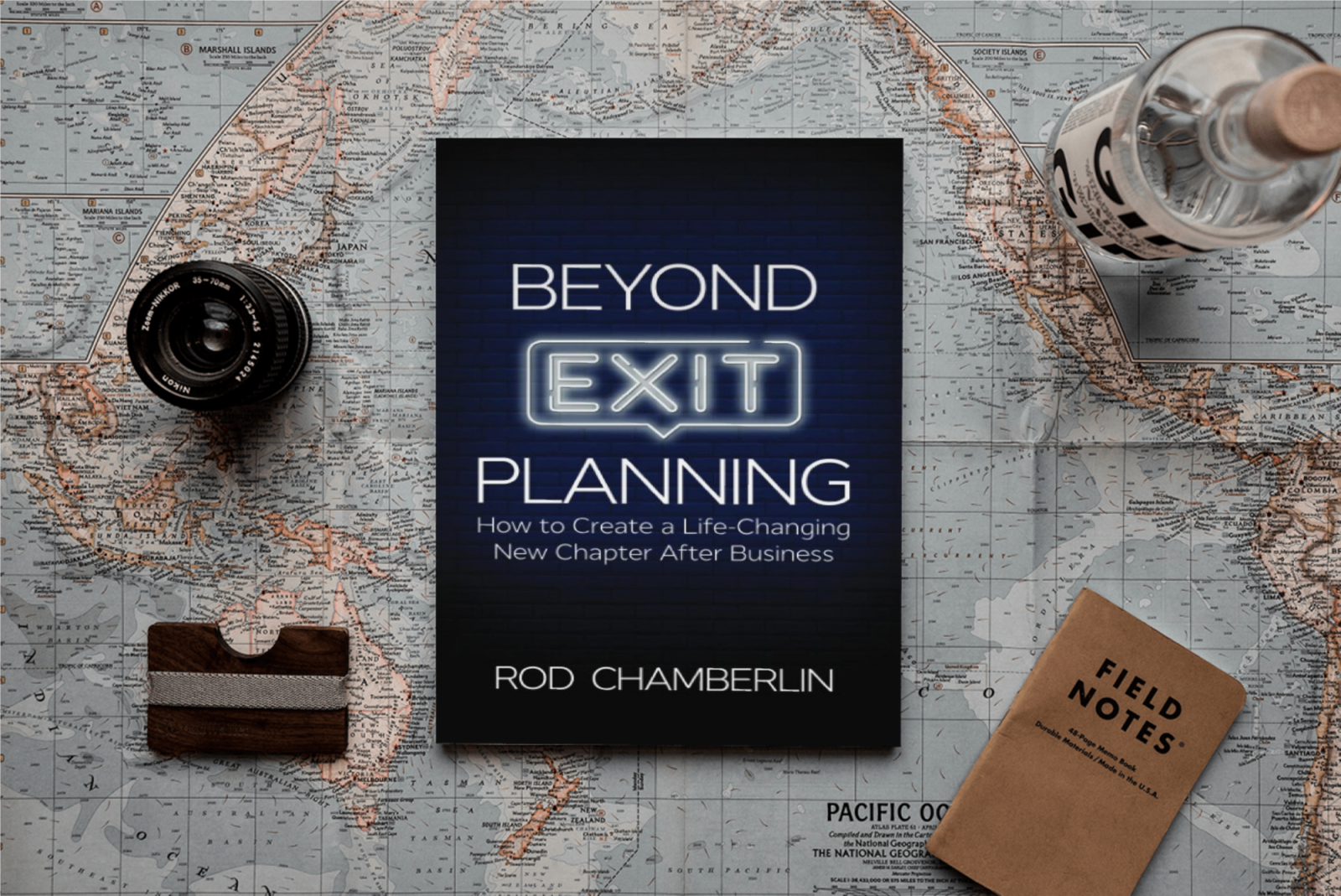 Beyond Exit Planning book on vintage map with travel essentials